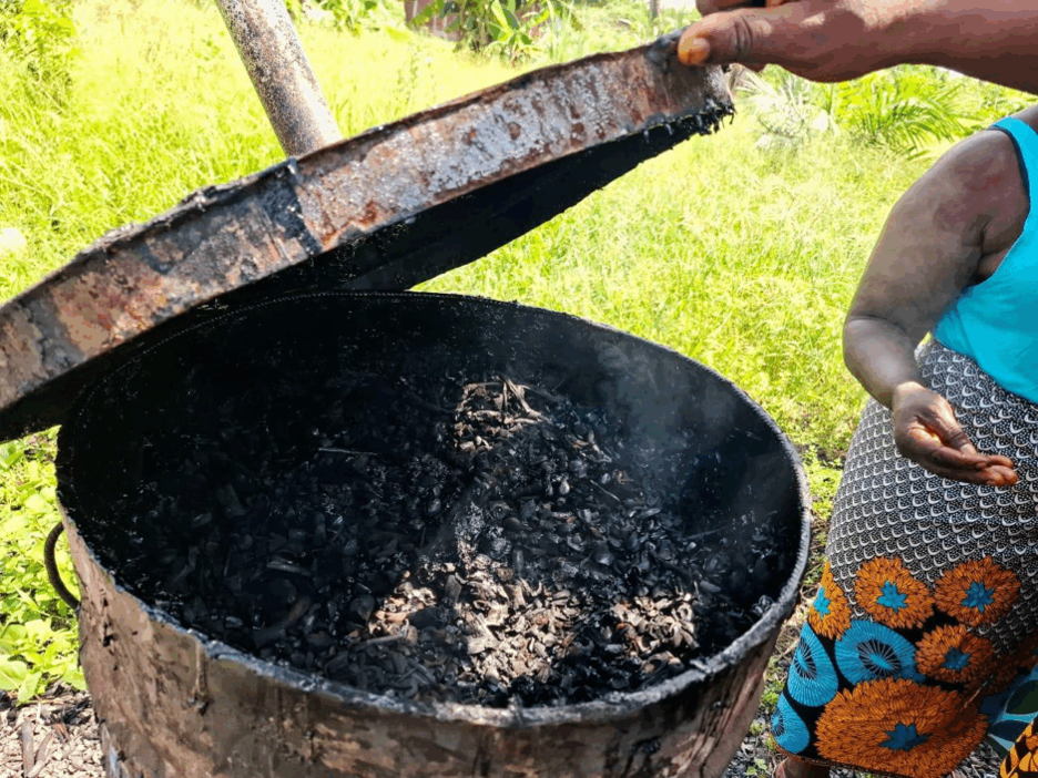 A mini steel (zinc) oven used to char palm kernel shells for charcoal production.