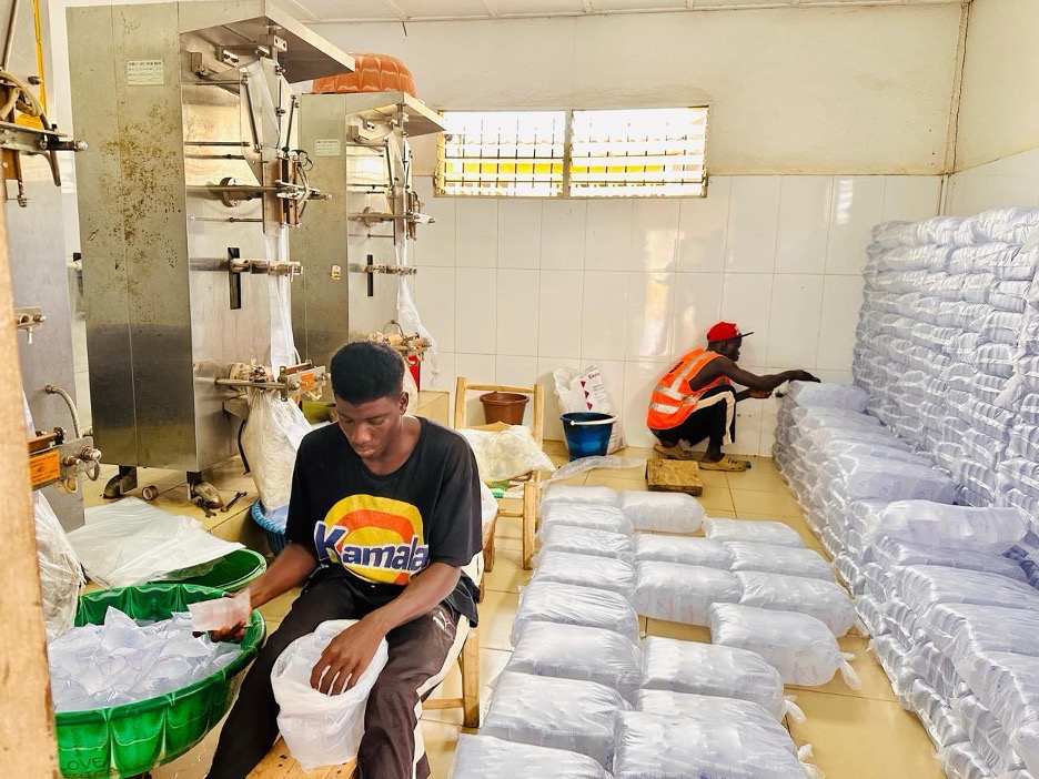 Workers at Dove Mineral Water Company prepare for a shutdown following an order from the Environmental Protection Agency